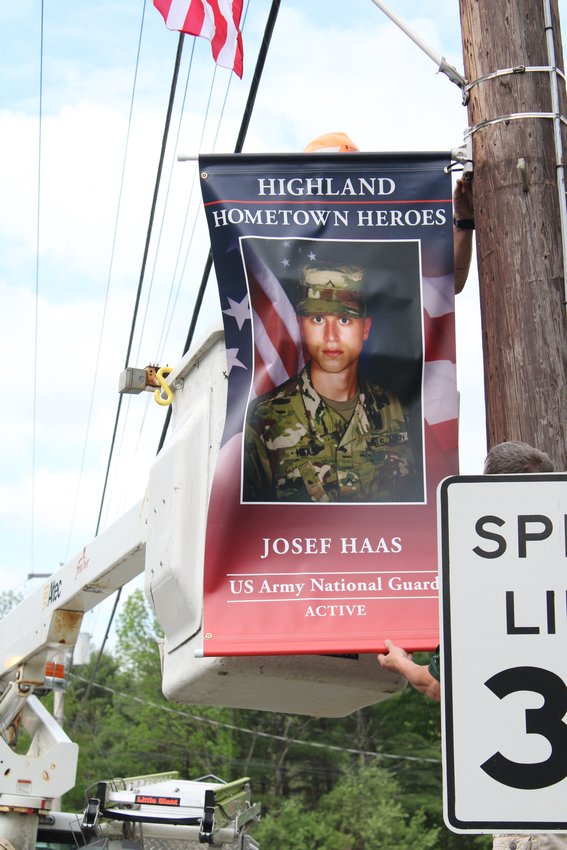 A banner honoring active serviceman Josef Haas.